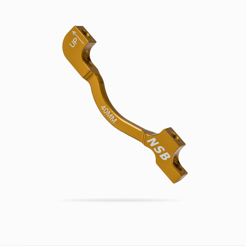 North Shore Billet 40mm post mount brake adapter gold colour