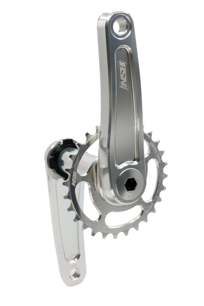 A silver metallic bicycle crankset with a chainring and a matching silver bottom bracket shell, shown against a plain white background.