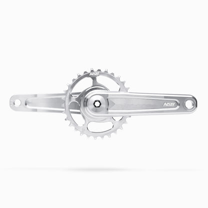 Silver Talon bicycle crankset with the not included chainring on a white background